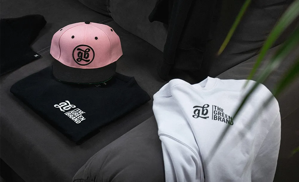 embroidered hat, custom printed shirt, and decorated crewneck sweatshirt