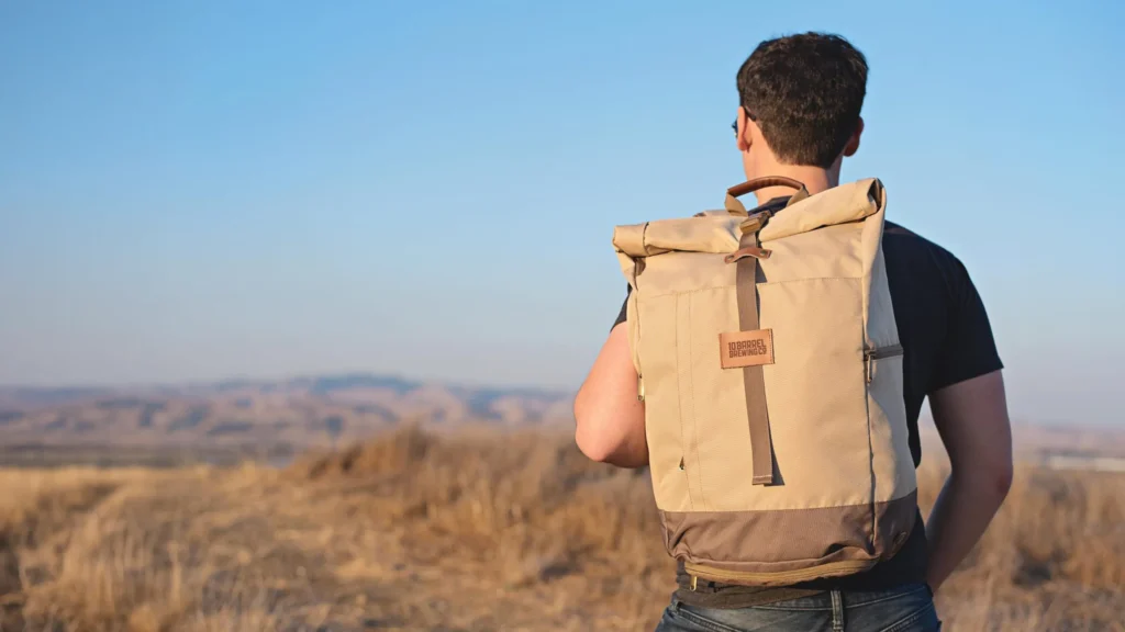 man standing outside wearing a promotional backpack product with a leather patch