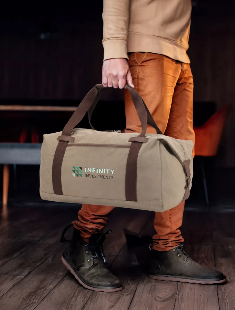 person holding a bag with a custom printed logo on the front