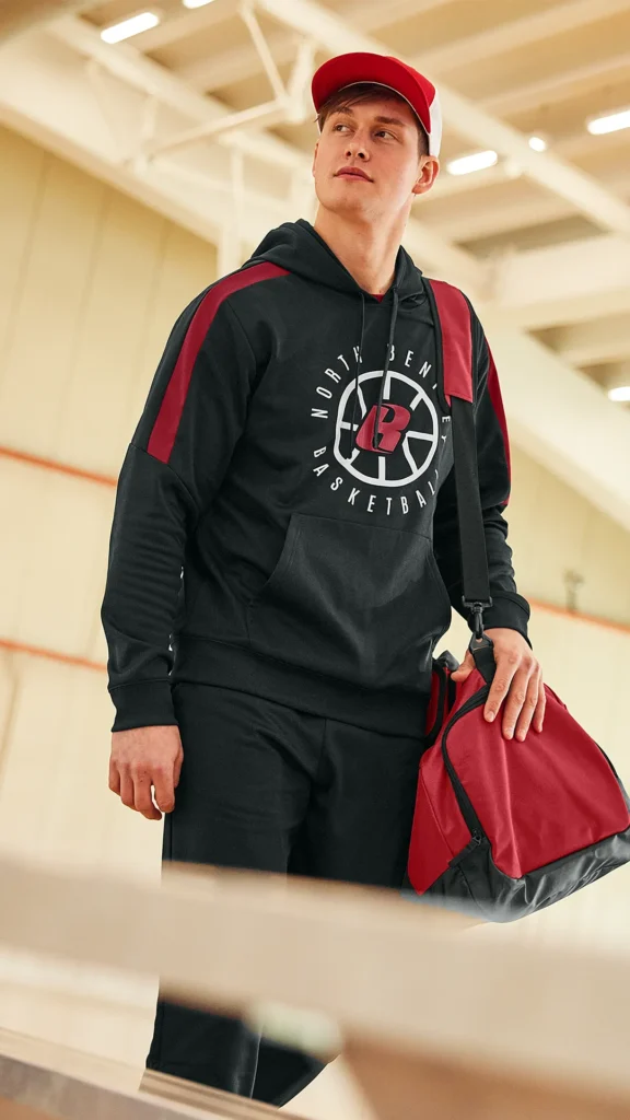 man wearing a hoodie with a graphic printed on the front